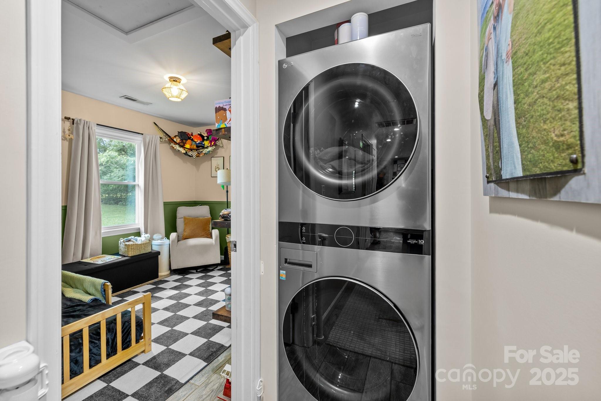 1108 Willoughby Road Monroe, NC 28110 - Photo 17 of 40 a view of a bedroom with washer and dryer