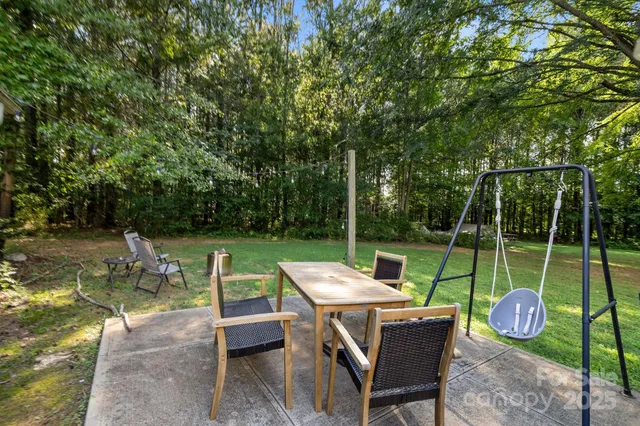 a view of an chairs and table in patio