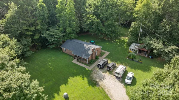 an aerial view of a house with a garden