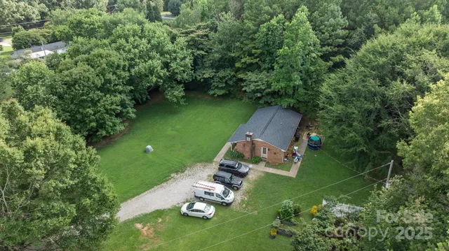an aerial view of houses with yard
