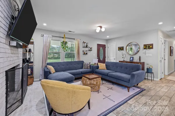 a living room with furniture and a flat screen tv