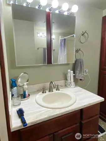 a bathroom with a sink and a mirror