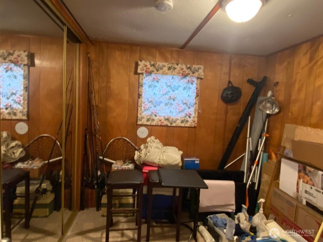 17103 Spanaway Loop Road South, Unit 15 Spanaway, WA 98387 - Photo 13 of 17 a view of a dining room with furniture and chandelier
