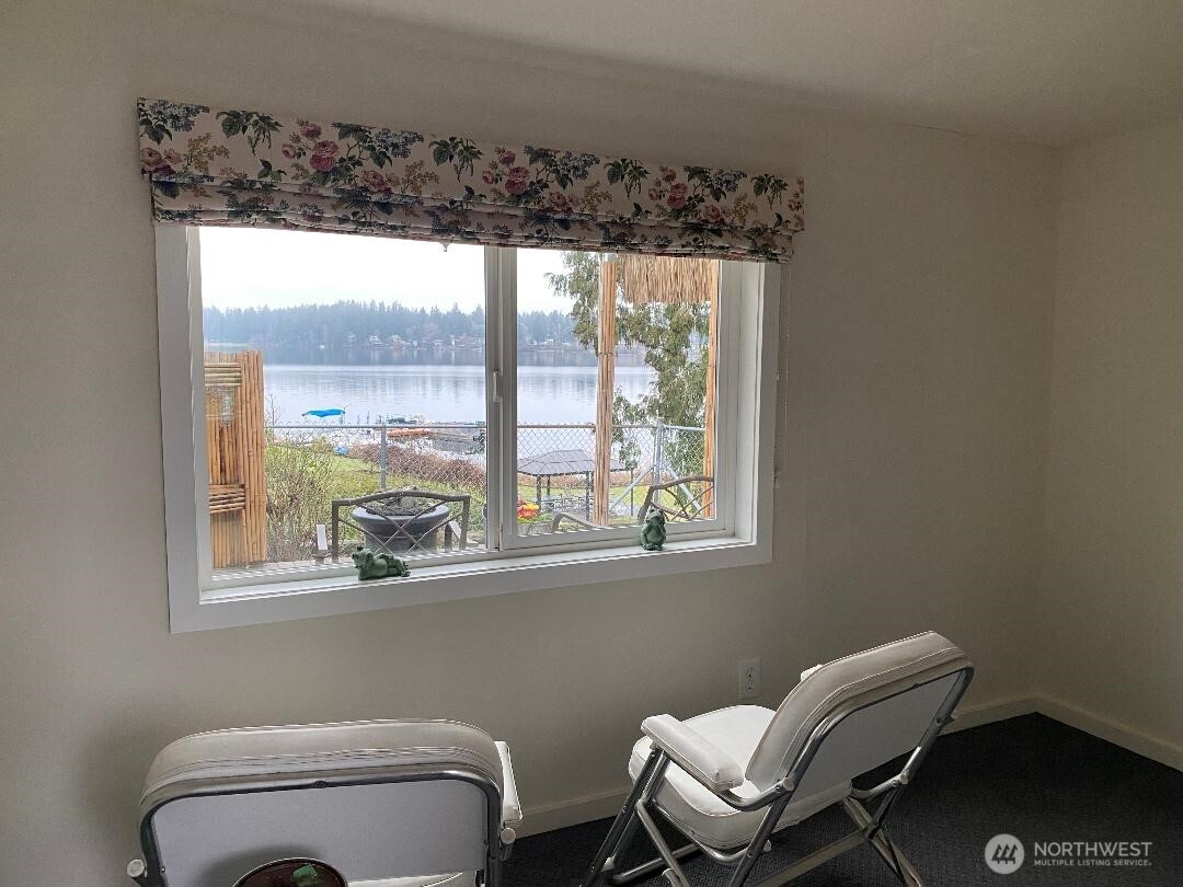 17103 Spanaway Loop Road South, Unit 15 Spanaway, WA 98387 - Photo 17 of 17 a bathroom with a toilet a sink and a window
