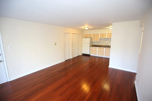 a view of a kitchen with wooden floor