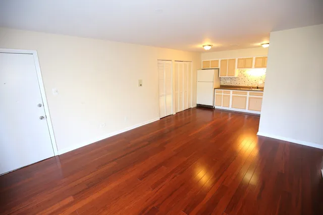 a view of a kitchen with wooden floor