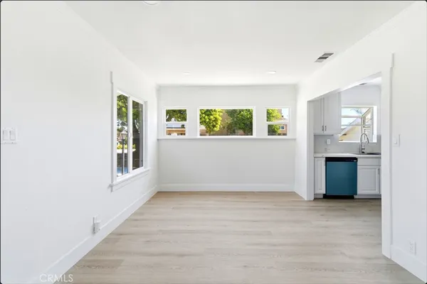 a view of a kitchen cabinets and wooden floor