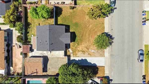 an aerial view of a house with a garden