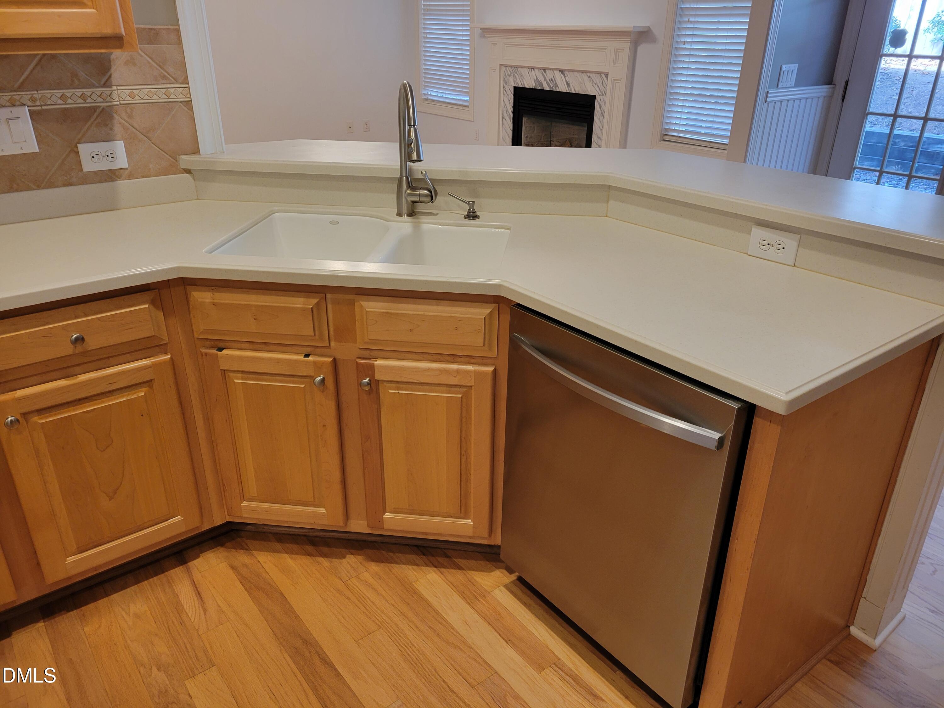 4044 Barton Park Place Raleigh, NC 27613 - Photo 12 of 20 a kitchen with a sink and a mirror