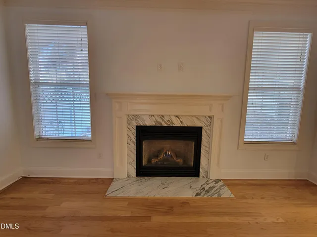 a living room with a fireplace and a floor