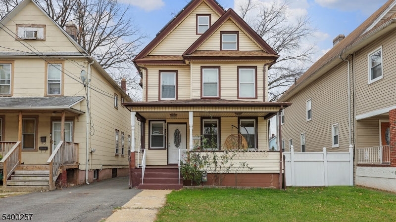 157 West 2nd Avenue Roselle, NJ 07203 - Photo 1 of 19 a front view of a house with a yard