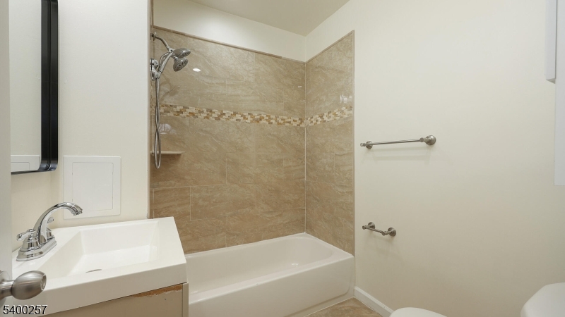 157 West 2nd Avenue Roselle, NJ 07203 - Photo 10 of 19 a bathroom with a sink and a tub