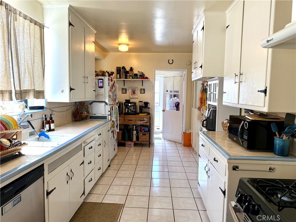 952 Balboa Drive Arcadia, CA 91007 - Photo 13 of 29 a kitchen with stainless steel appliances a stove a sink and a refrigerator