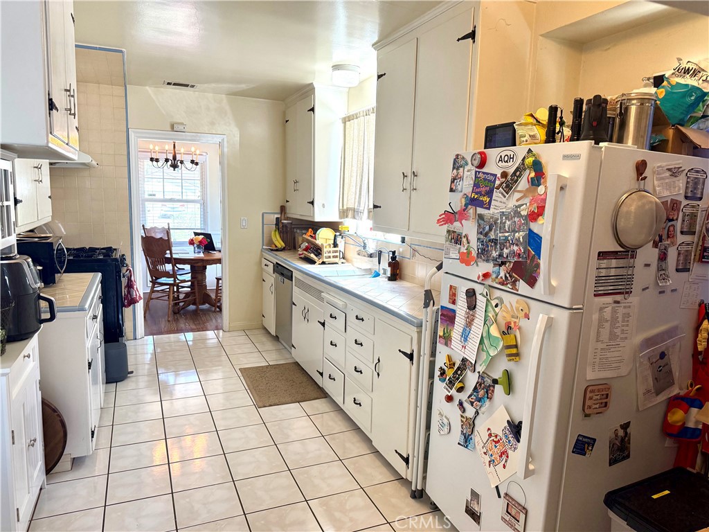952 Balboa Drive Arcadia, CA 91007 - Photo 14 of 29 a large white kitchen with lots of appliances