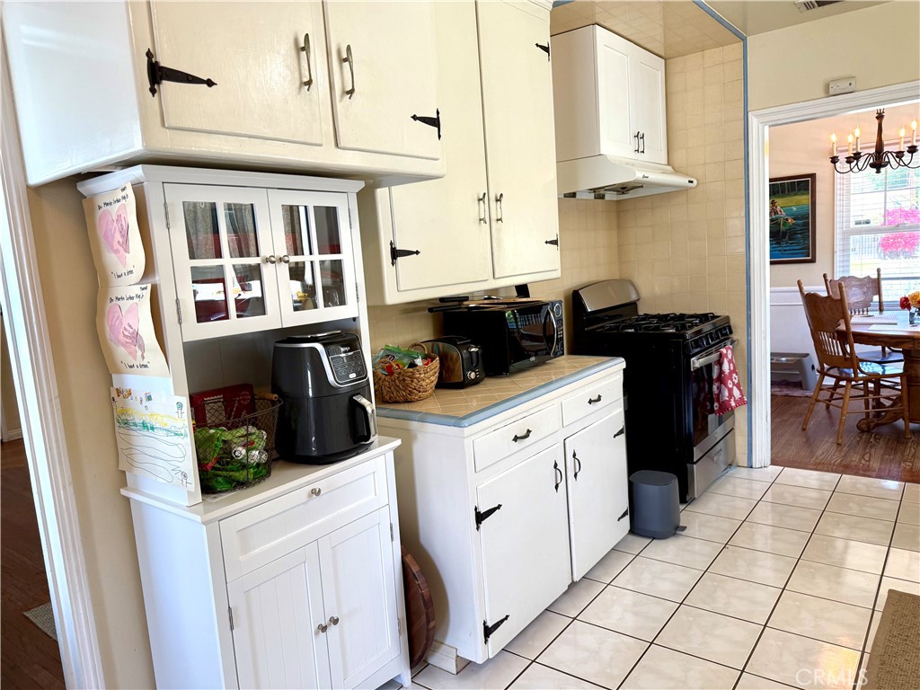 952 Balboa Drive Arcadia, CA 91007 - Photo 17 of 29 a kitchen with stainless steel appliances kitchen island granite countertop a refrigerator and a stove top oven
