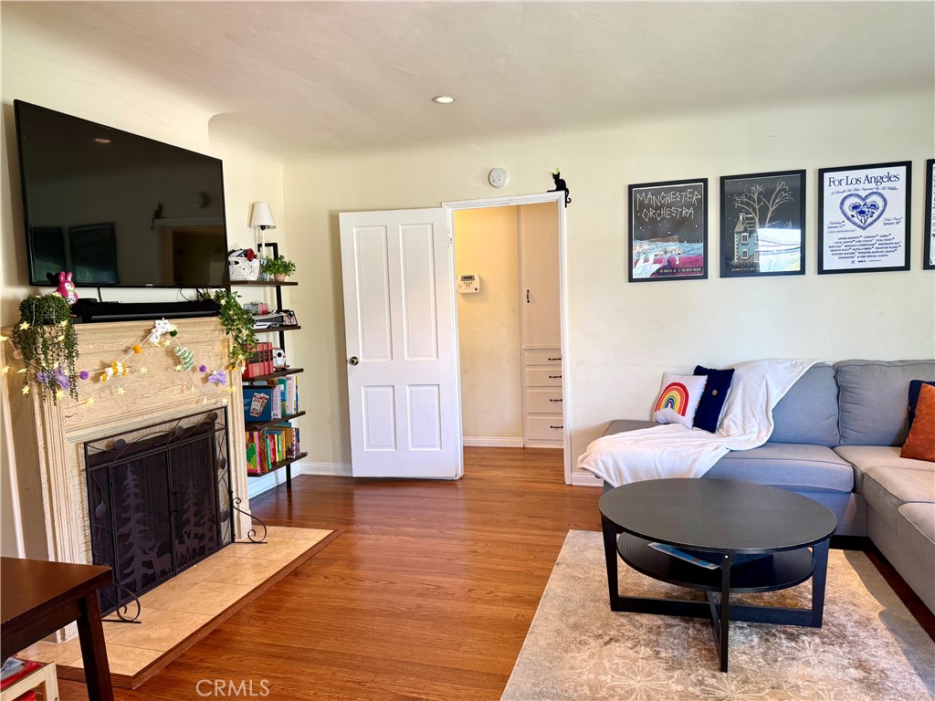 952 Balboa Drive Arcadia, CA 91007 - Photo 5 of 29 a living room with furniture a flat screen tv and a fireplace