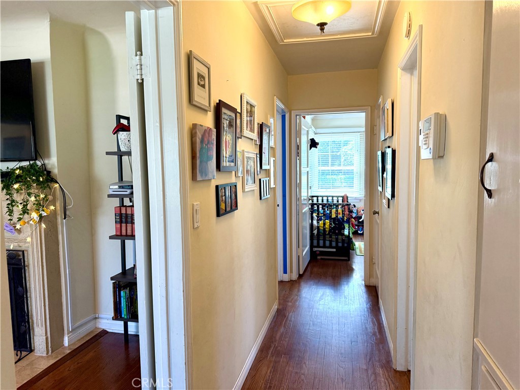 952 Balboa Drive Arcadia, CA 91007 - Photo 9 of 29 a view of a hallway with wooden floor and livingroom and furniture