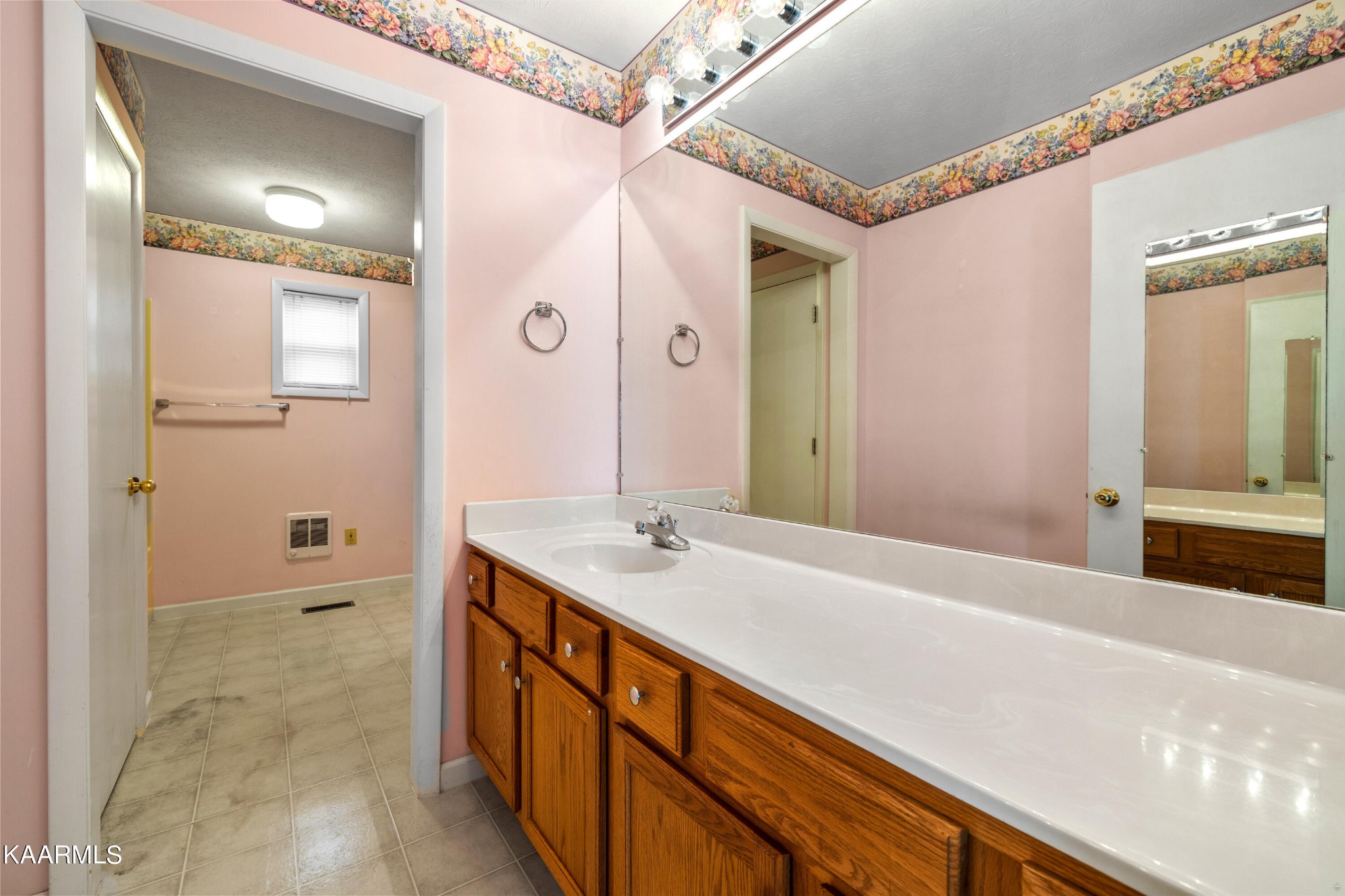 6701 Cate Road Powell, TN 37849 - Photo 15 of 18 a spacious bathroom with a granite countertop sink and a mirror
