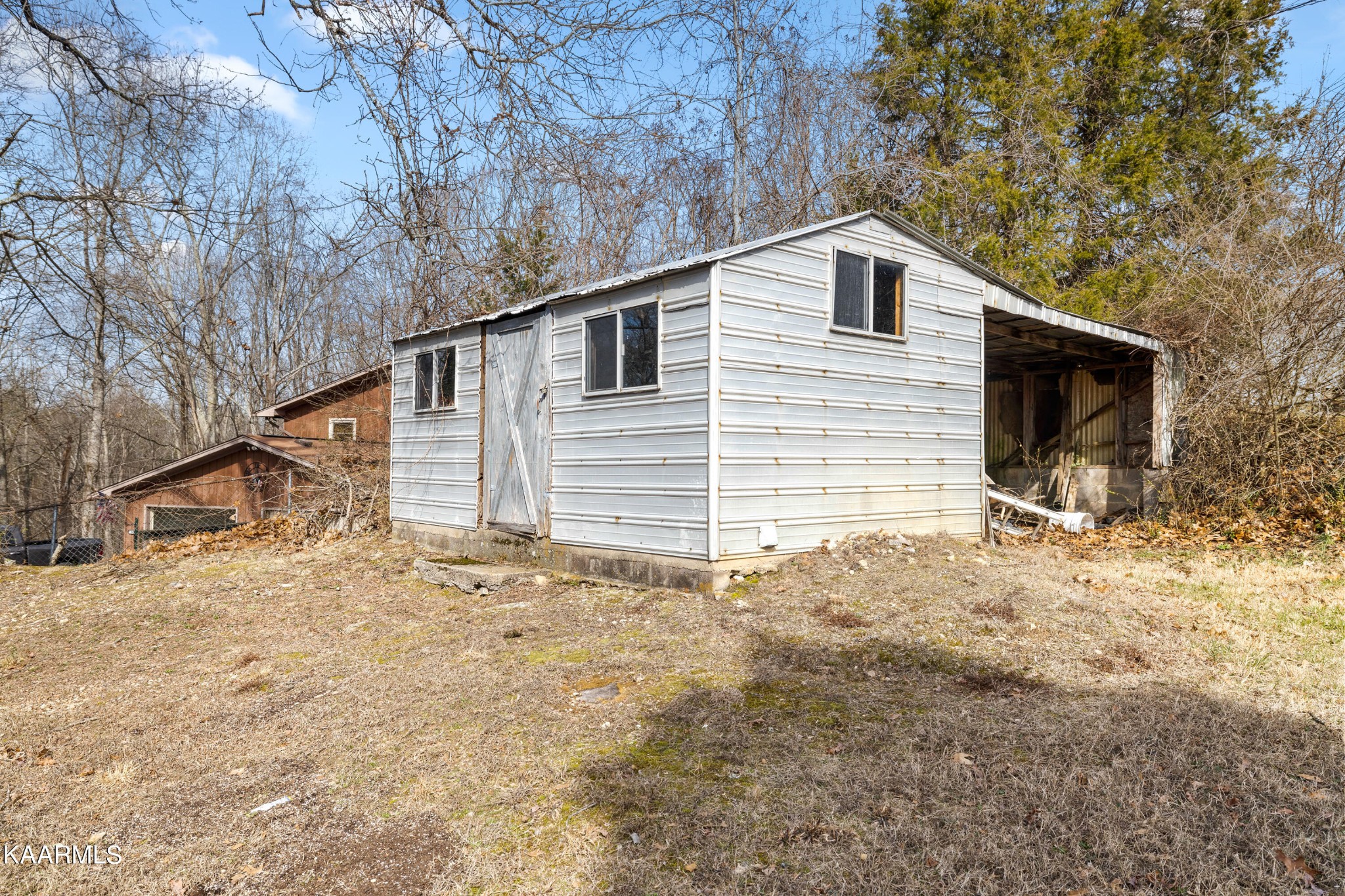 6701 Cate Road Powell, TN 37849 - Photo 17 of 18 a view of a house with a yard and garage