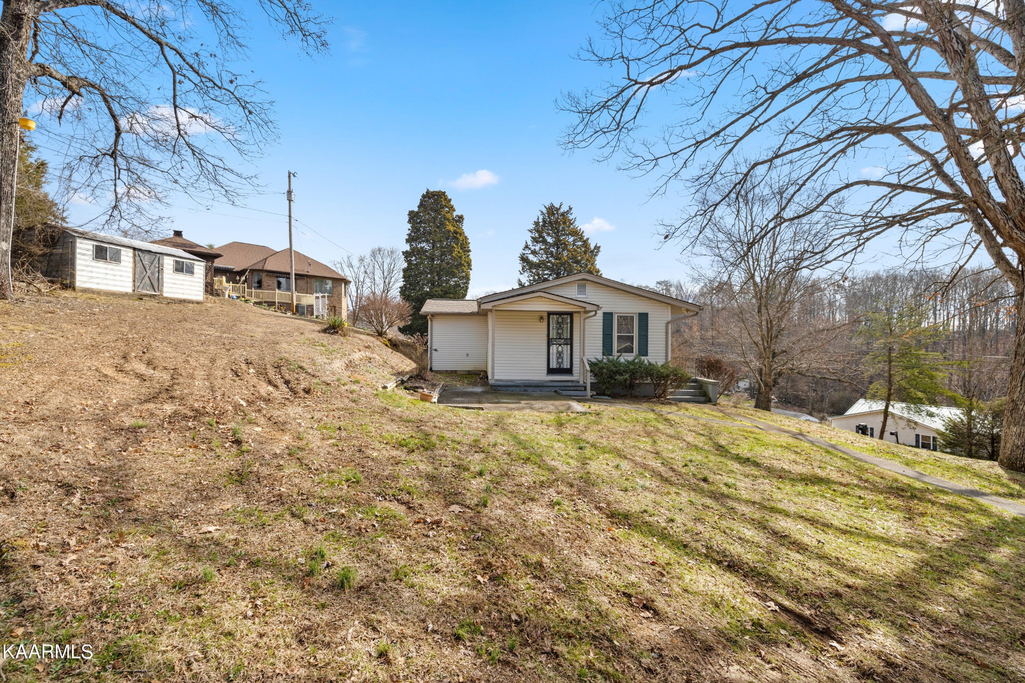 6701 Cate Road Powell, TN 37849 - Photo 3 of 18 a front view of a house with a yard