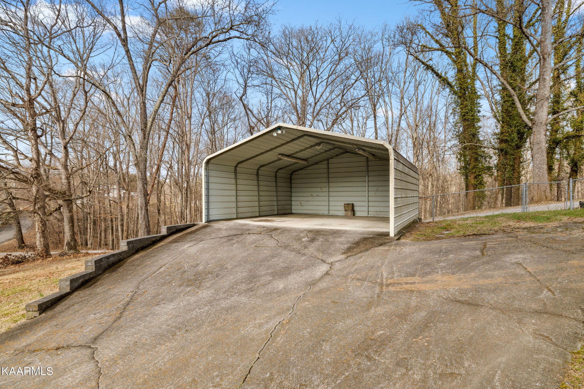 6701 Cate Road Powell, TN 37849 - Photo 5 of 18 a front view of a house with a yard and garage