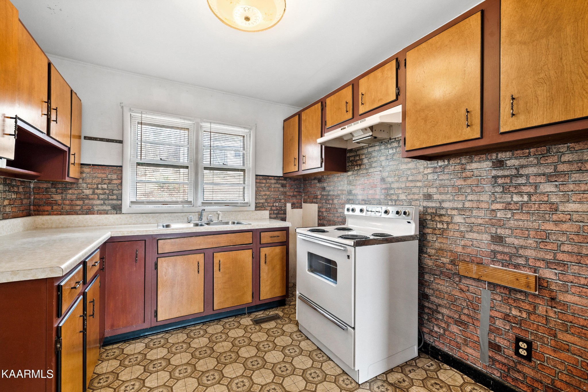 6701 Cate Road Powell, TN 37849 - Photo 7 of 18 a kitchen with a stove sink and cabinets