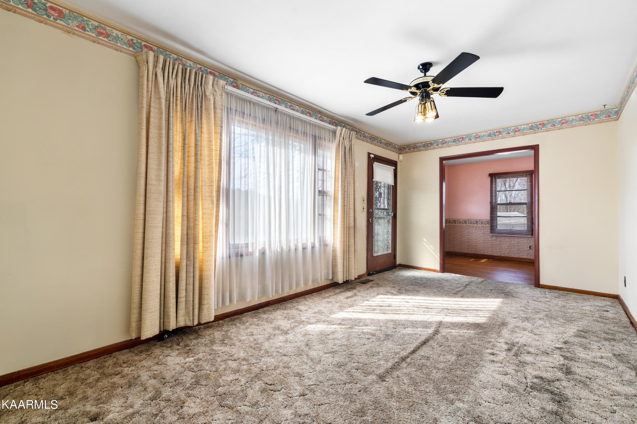 6701 Cate Road Powell, TN 37849 - Photo 8 of 18 a view of a livingroom with a ceiling fan and window
