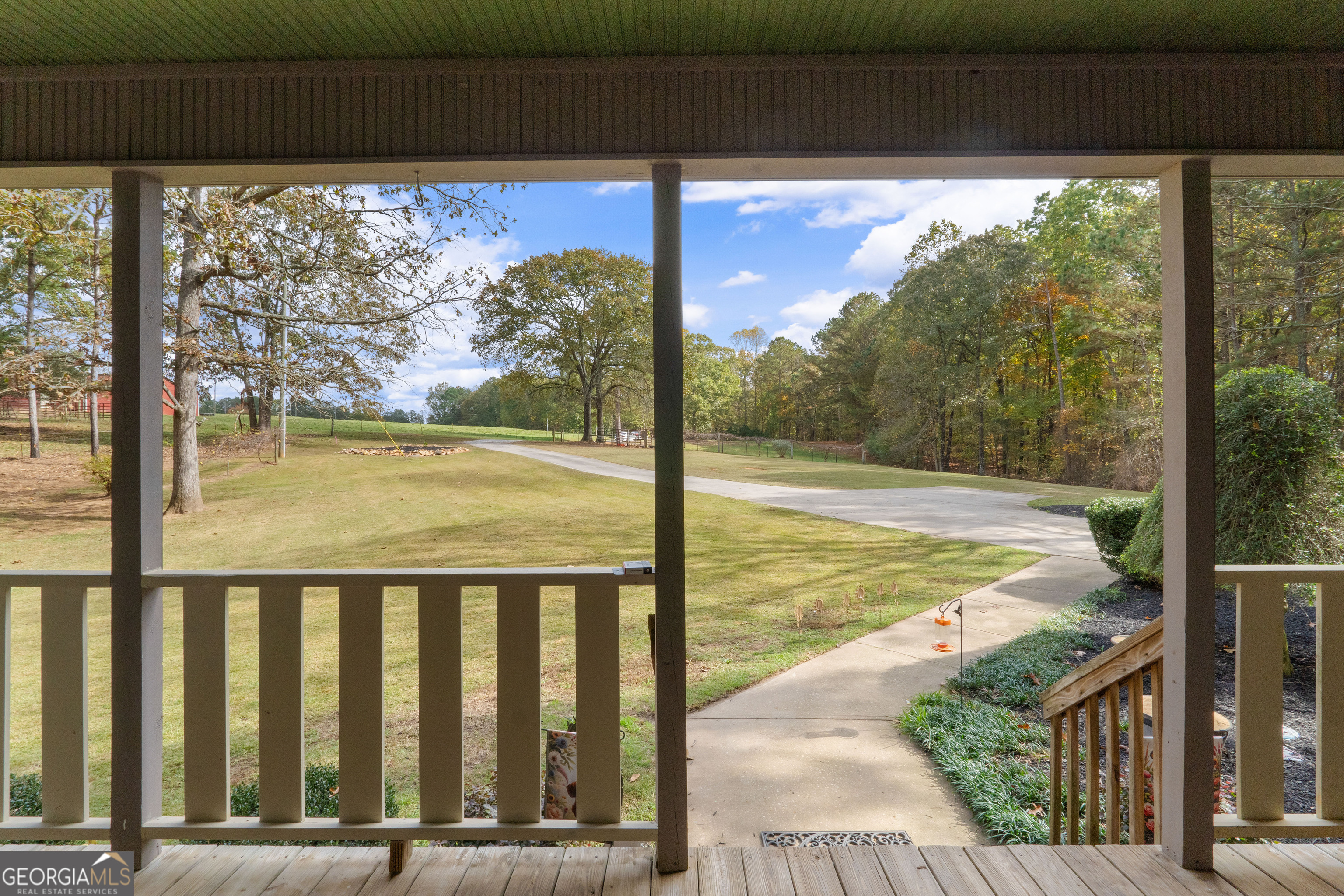 335 Gum Creek Road Roopville, GA 30170 - Photo 14 of 56 a view of a balcony with floor to ceiling windows and wooden fence