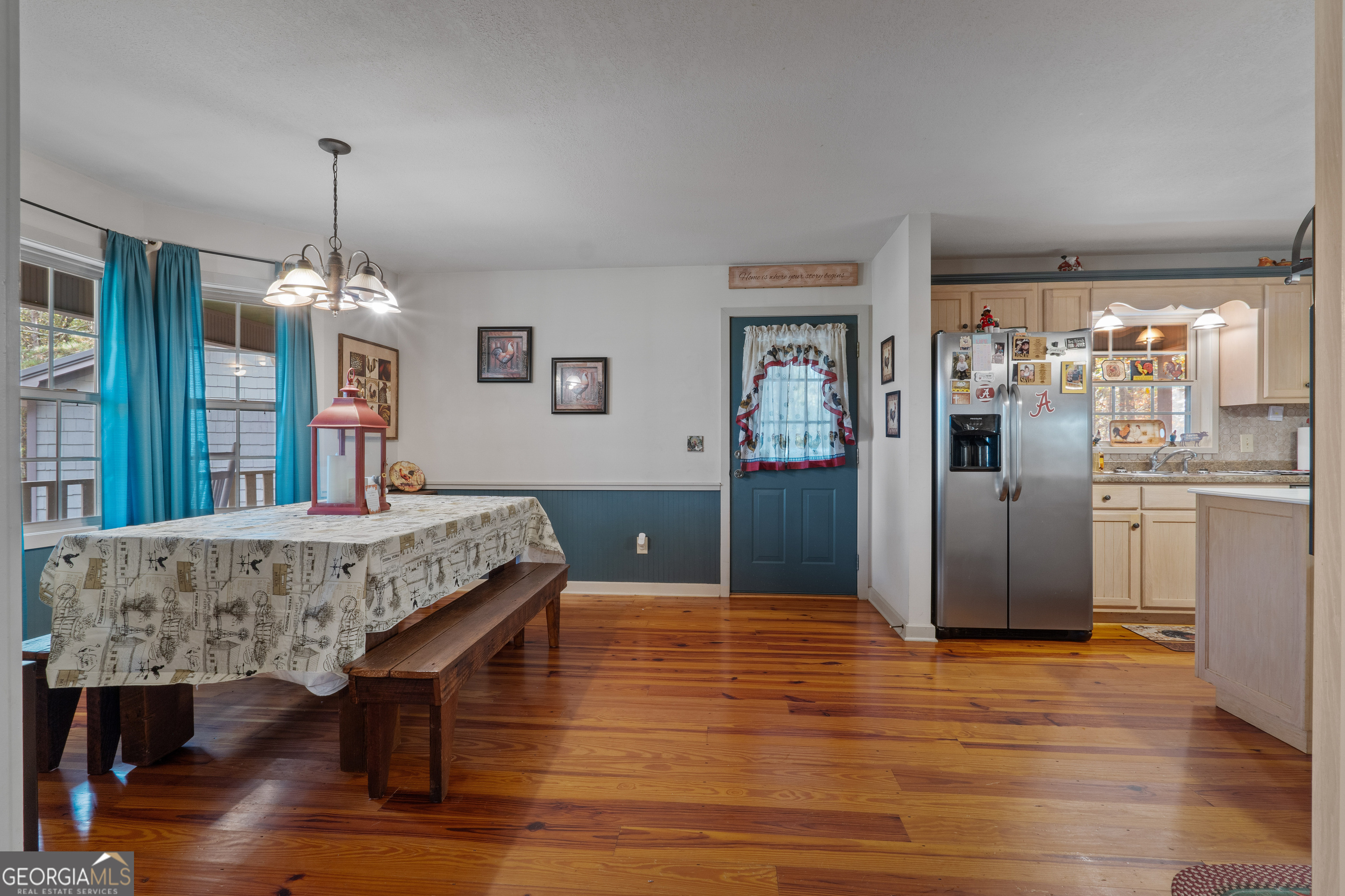335 Gum Creek Road Roopville, GA 30170 - Photo 28 of 56 a living room with kitchen island dining table and wooden floor