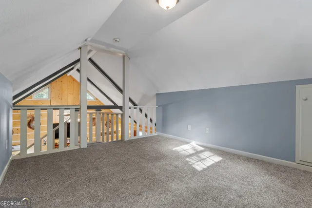 a bed room with a bed and a chandelier