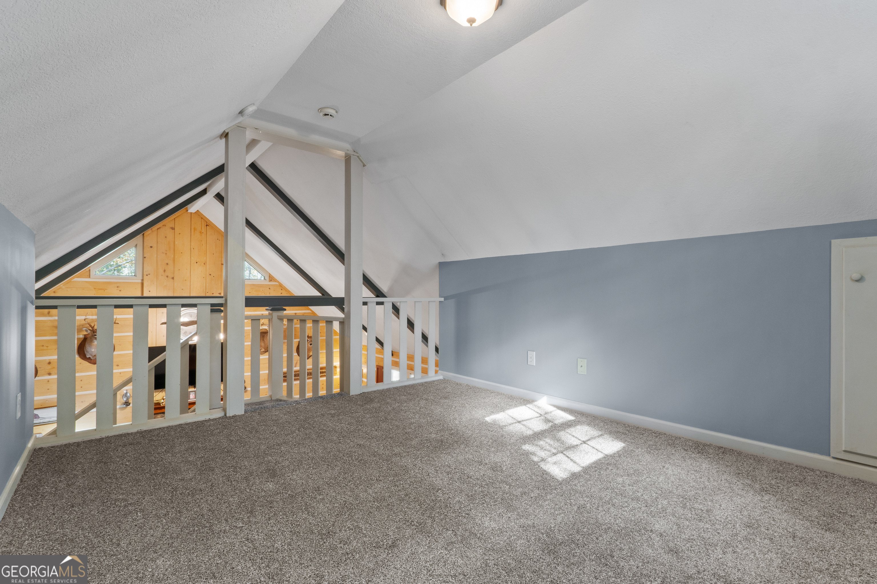 335 Gum Creek Road Roopville, GA 30170 - Photo 33 of 56 a view of an empty room with a staircase