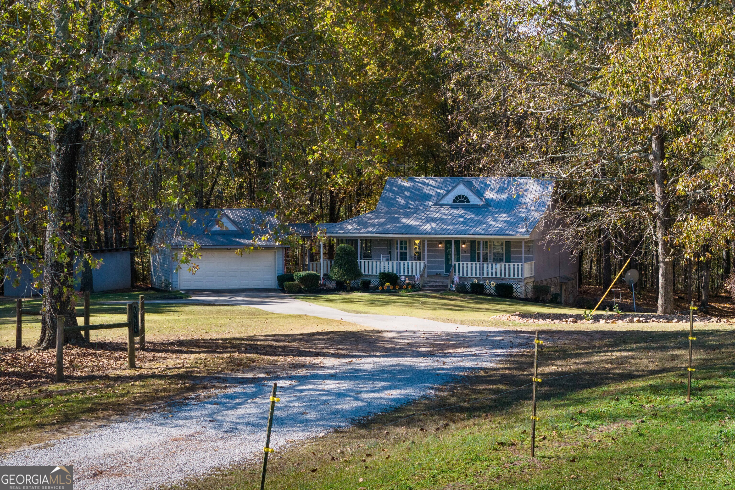 335 Gum Creek Road Roopville, GA 30170 - Photo 4 of 56 a front view of a house with a yard