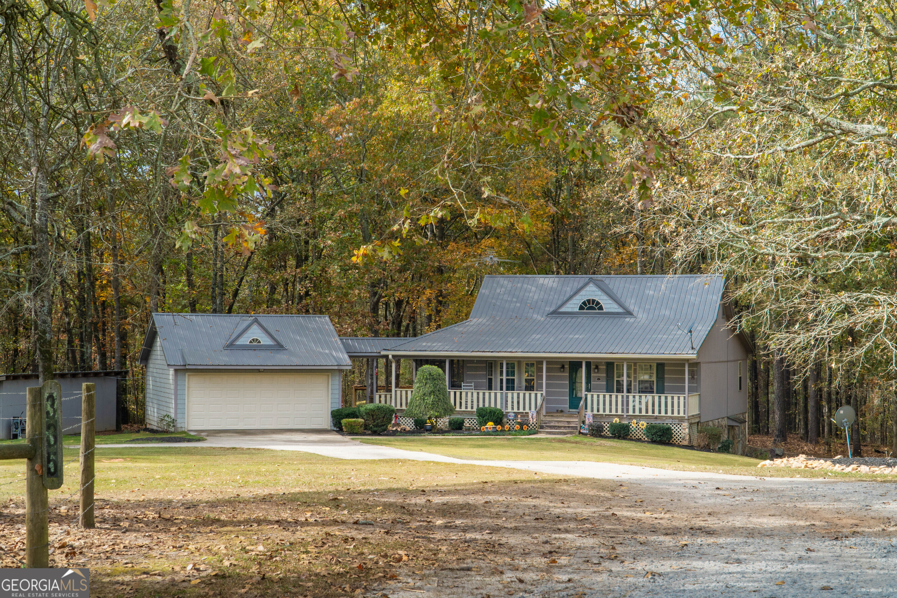 335 Gum Creek Road Roopville, GA 30170 - Photo 7 of 56 a front view of a house with a yard
