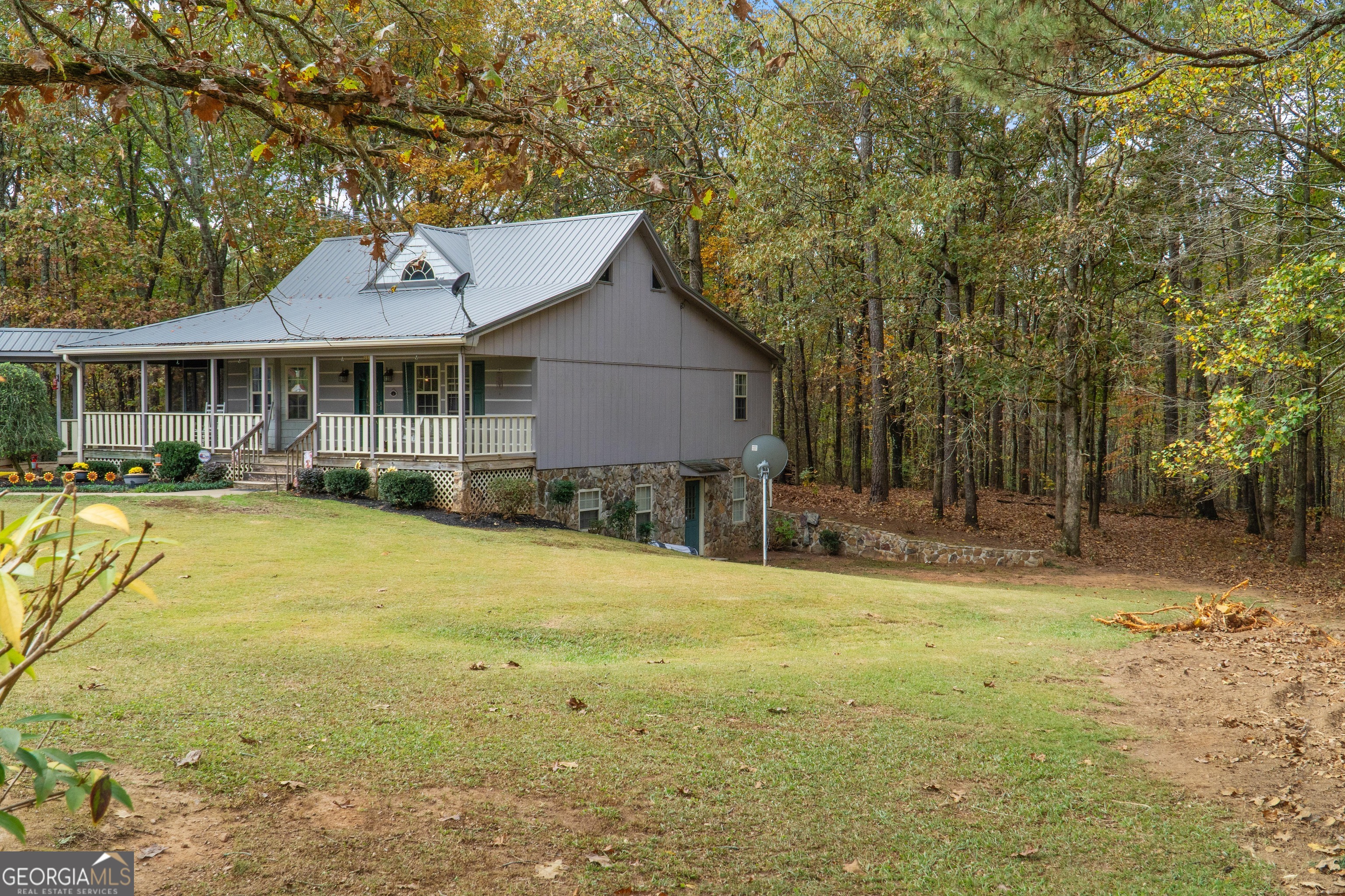 335 Gum Creek Road Roopville, GA 30170 - Photo 9 of 56 a front view of a house with a yard