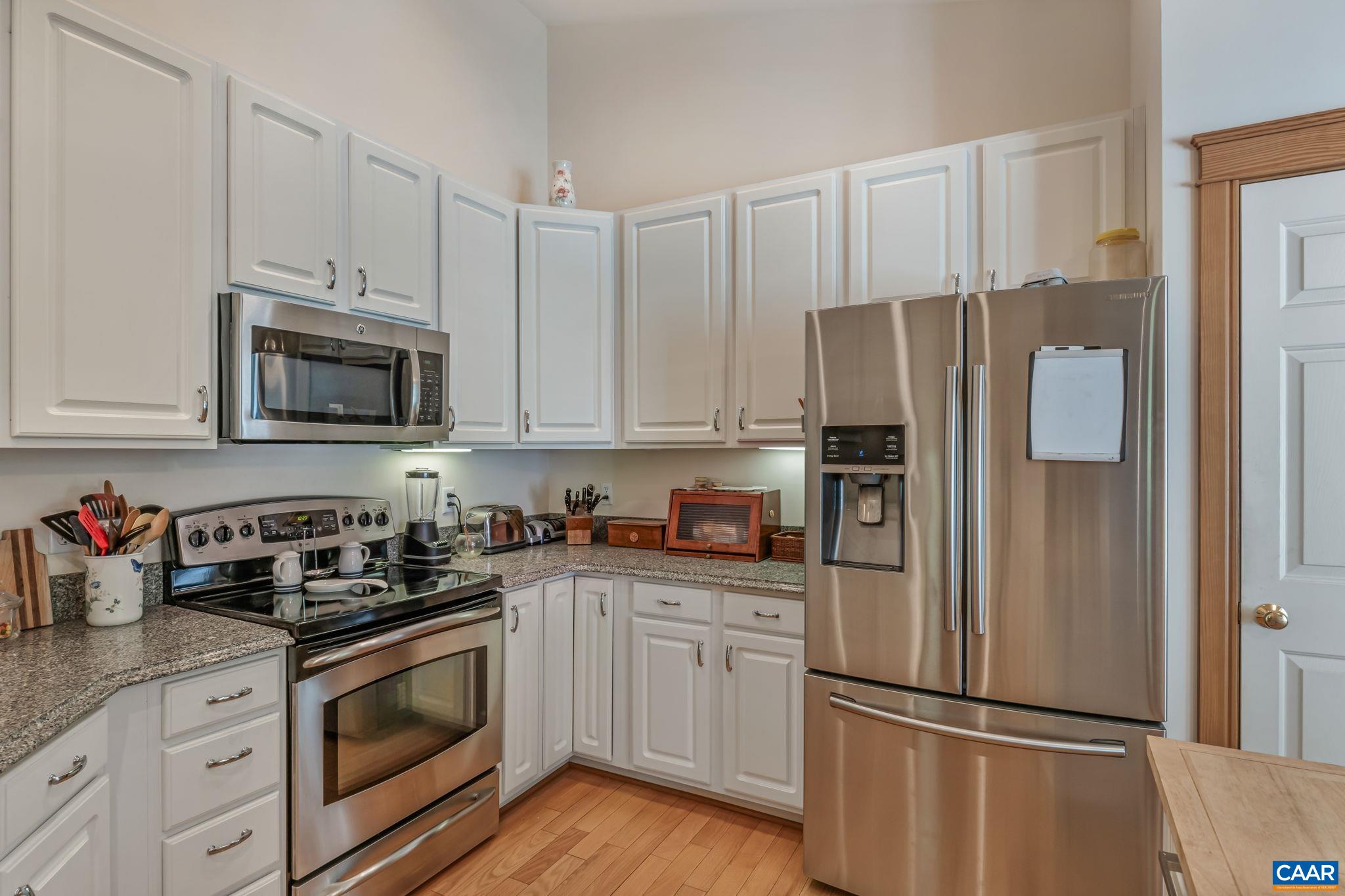 4 Ashton Road Palmyra, VA 22963 - Photo 17 of 34 a kitchen with white cabinets and stainless steel appliances