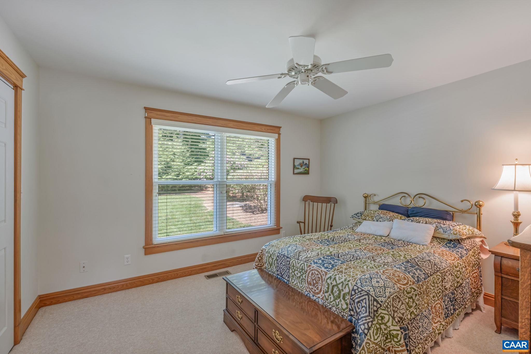 4 Ashton Road Palmyra, VA 22963 - Photo 21 of 34 a bedroom with a large bed and a window