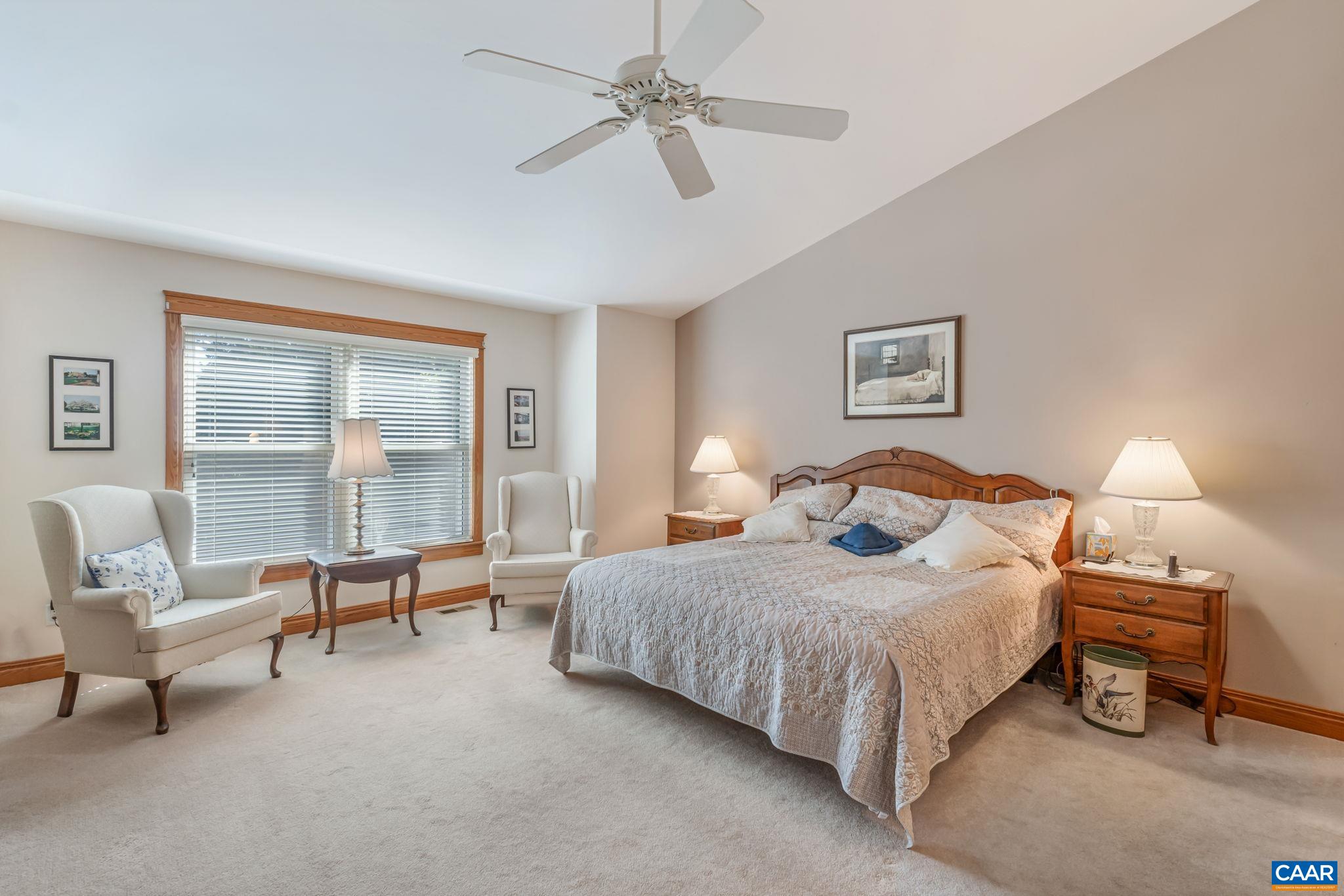4 Ashton Road Palmyra, VA 22963 - Photo 24 of 34 a bedroom with a bed a couch and large window