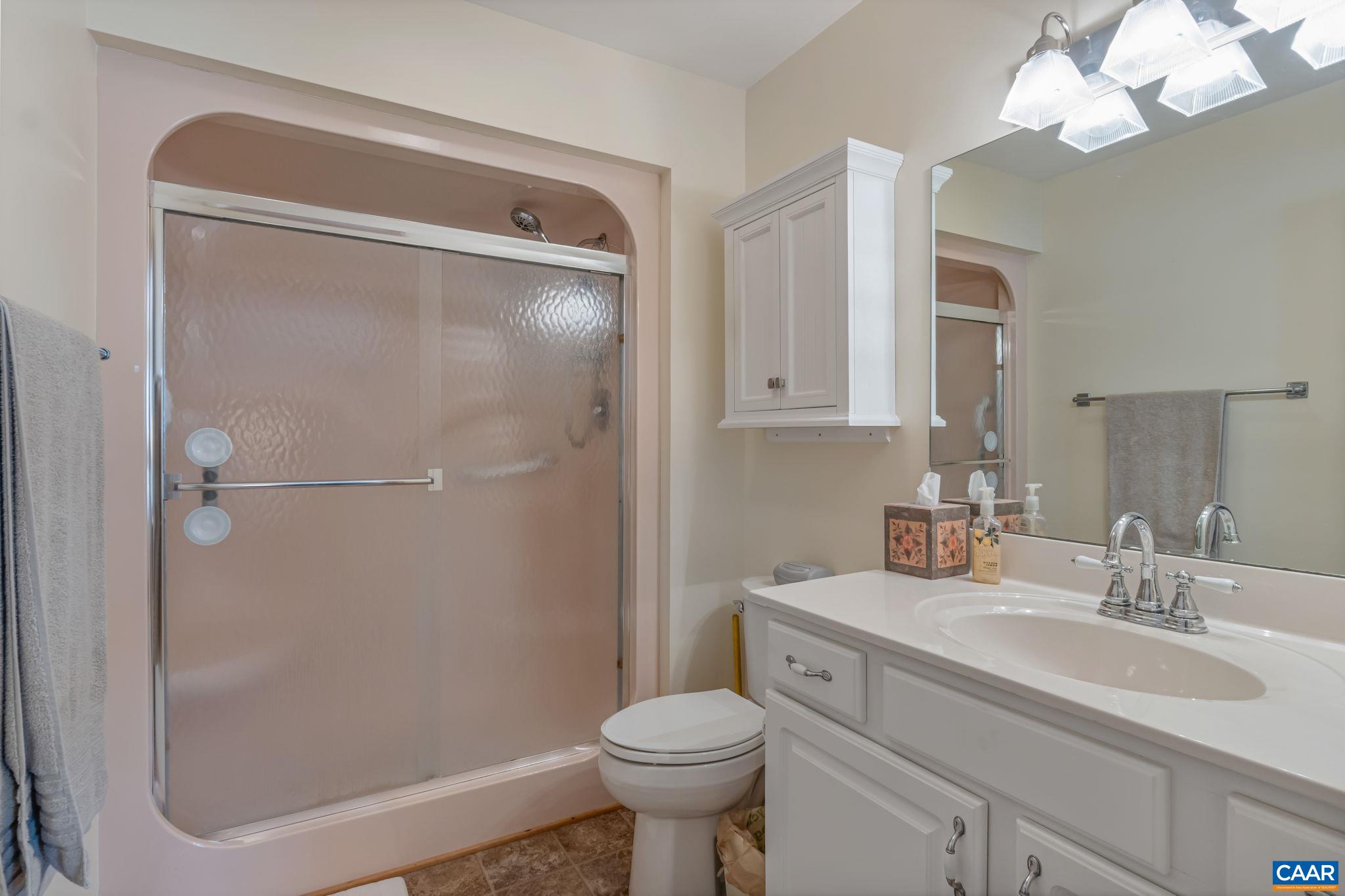 4 Ashton Road Palmyra, VA 22963 - Photo 26 of 34 a bathroom with a sink toilet and shower