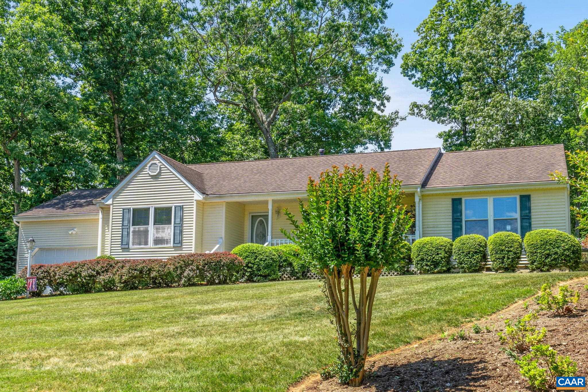 4 Ashton Road Palmyra, VA 22963 - Photo 5 of 34 a house that is sitting in front of a big yard with potted plants and large trees
