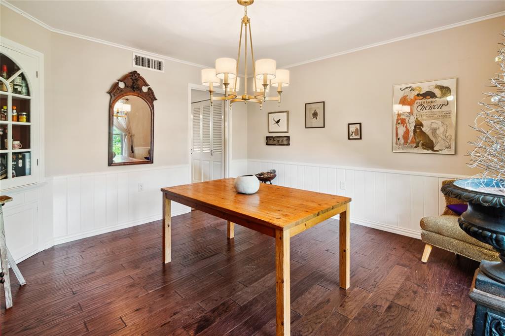 4104 Evergreen Drive Waco, TX 76708 - Photo 14 of 36 a workspace with wooden floor table and paintings on the wall