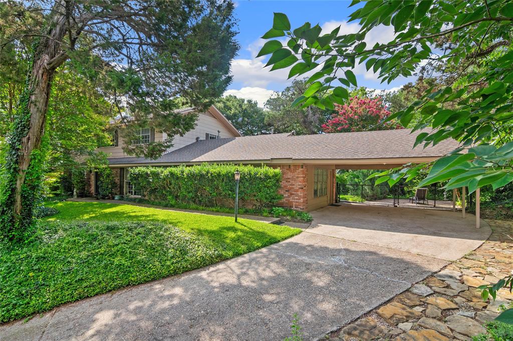 4104 Evergreen Drive Waco, TX 76708 - Photo 2 of 36 a front view of a house with a yard and potted plants