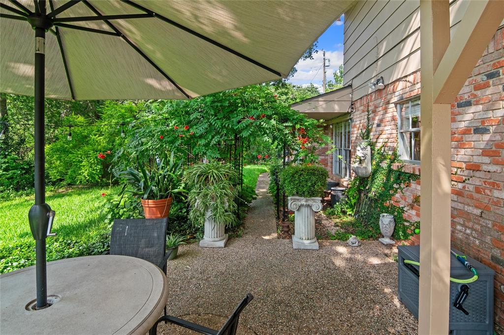 4104 Evergreen Drive Waco, TX 76708 - Photo 28 of 36 a backyard with plants and outdoor seating