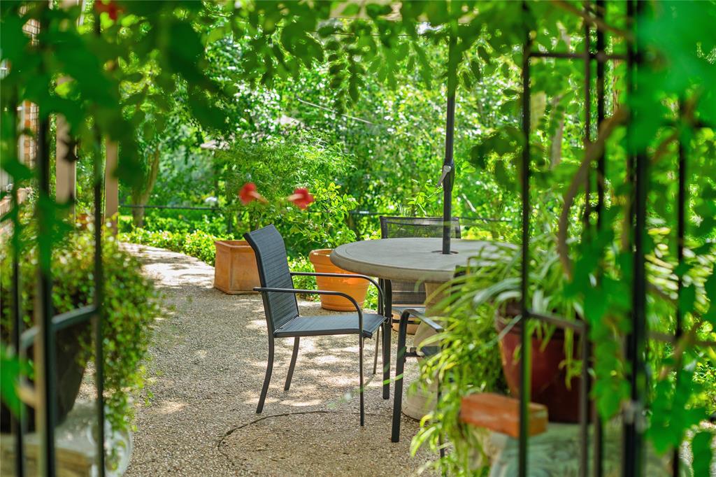 4104 Evergreen Drive Waco, TX 76708 - Photo 30 of 36 a view of a patio with table and chairs and potted plants