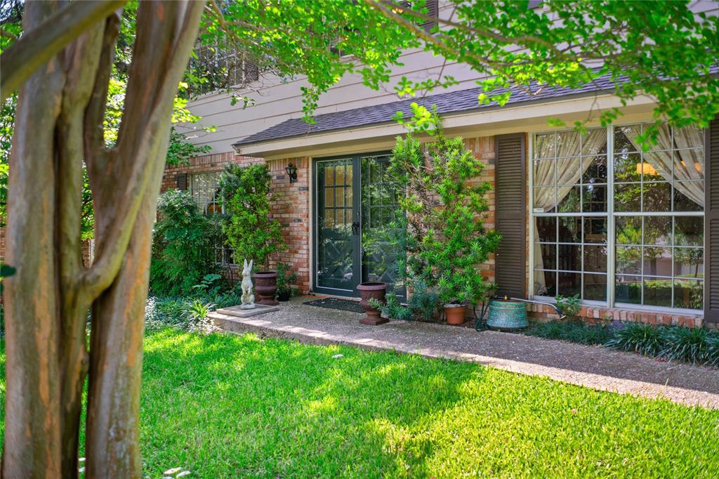 4104 Evergreen Drive Waco, TX 76708 - Photo 4 of 36 a view of a backyard with table and chairs and potted plants