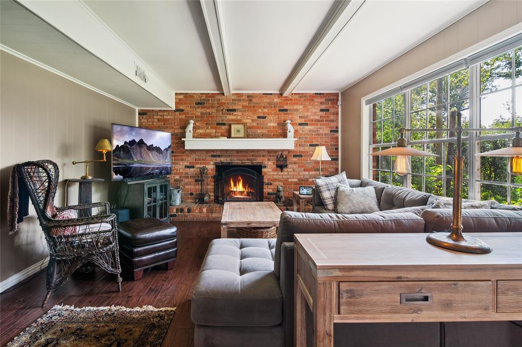 4104 Evergreen Drive Waco, TX 76708 - Photo 7 of 36 a living room with furniture a fireplace and floor to ceiling window