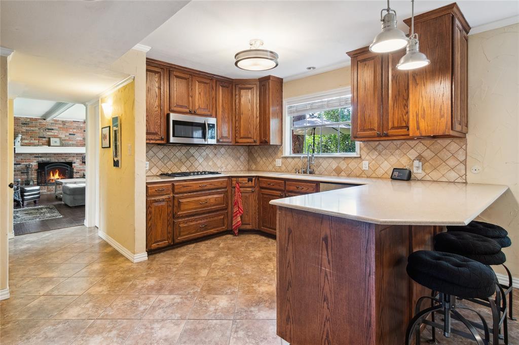 4104 Evergreen Drive Waco, TX 76708 - Photo 9 of 36 a kitchen with a sink cabinets and window