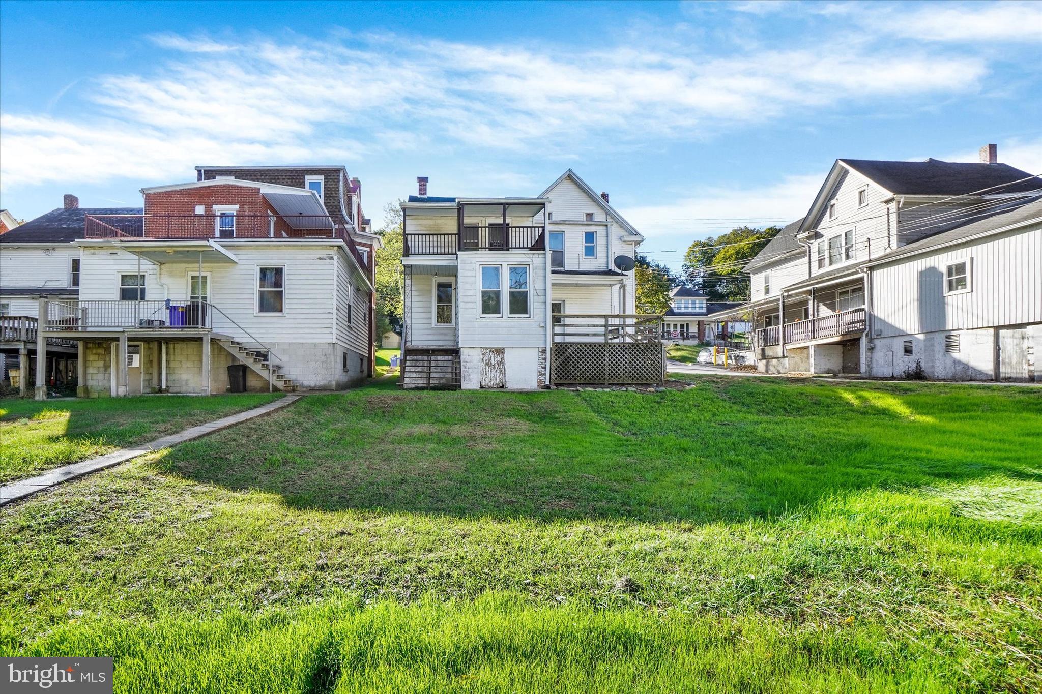 124 West Main Street Windsor, PA 17366 - Photo 23 of 24 a front view of a house with a garden and deck