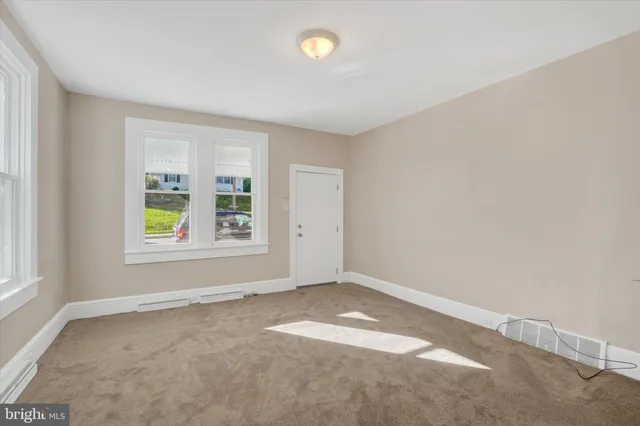 an empty room with windows