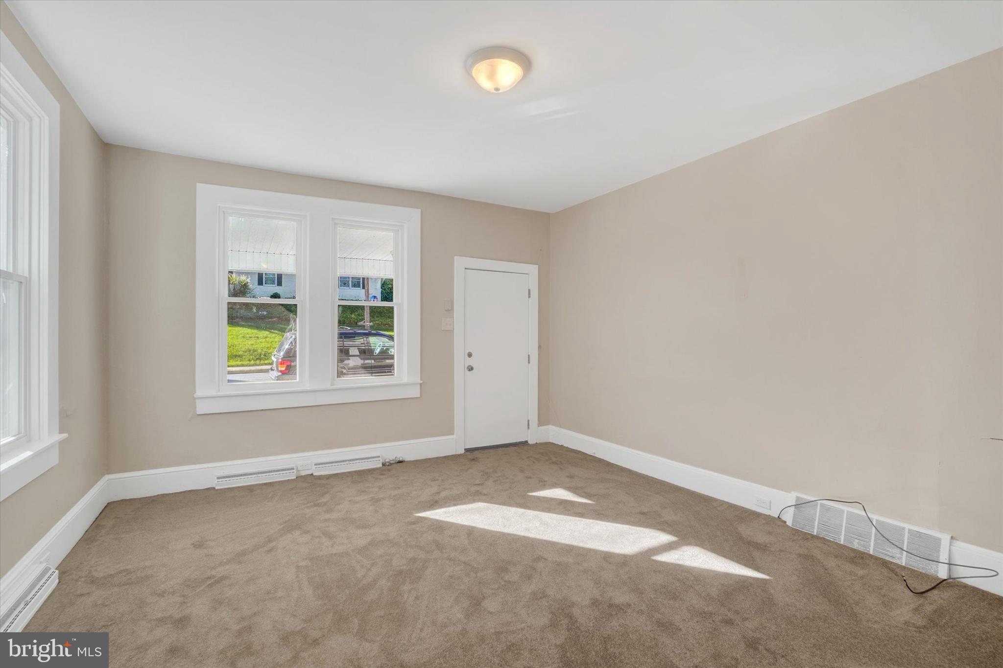 124 West Main Street Windsor, PA 17366 - Photo 3 of 24 an empty room with windows