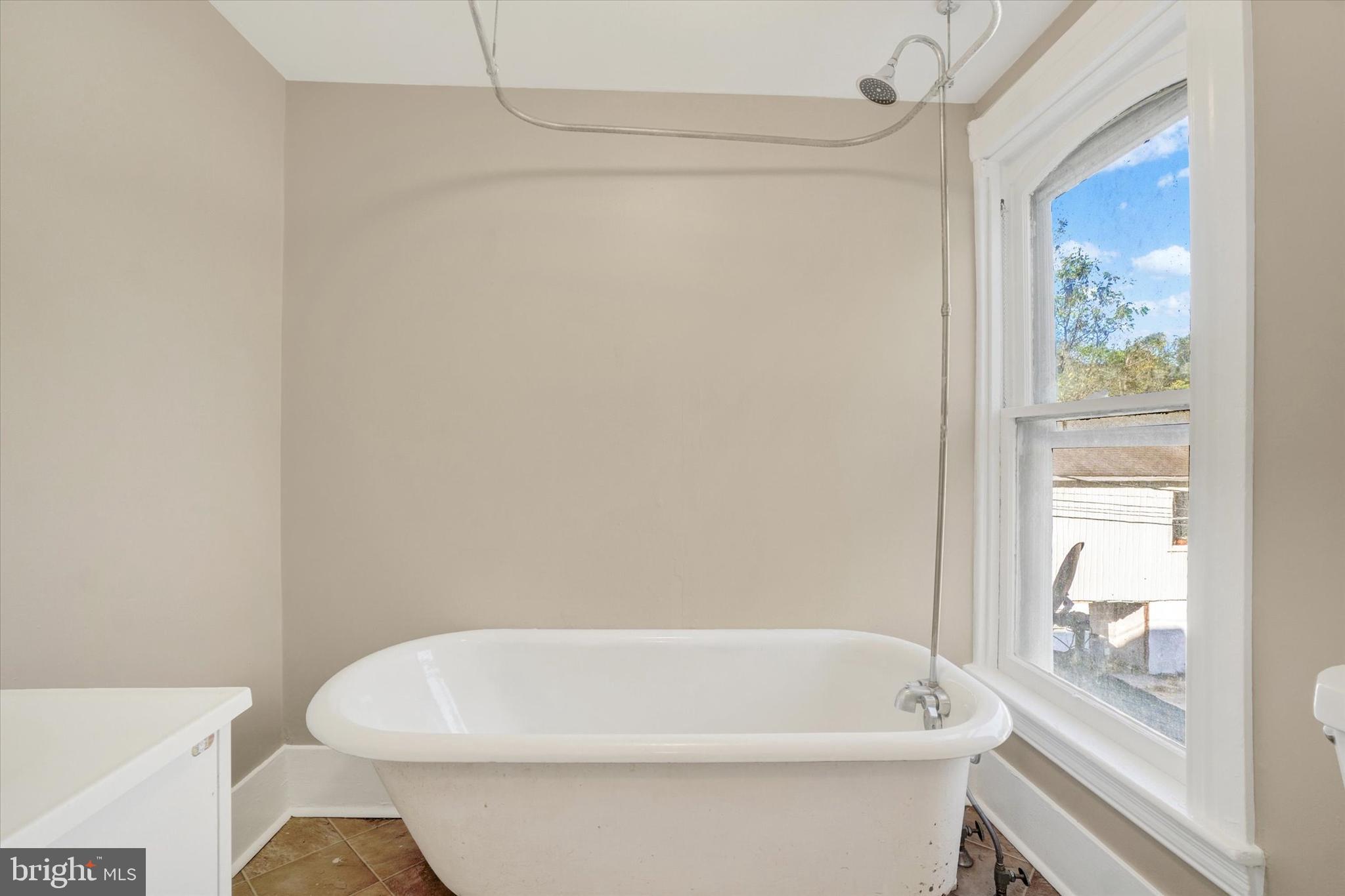 124 West Main Street Windsor, PA 17366 - Photo 10 of 24 a white bath tub sitting next to a white toilet